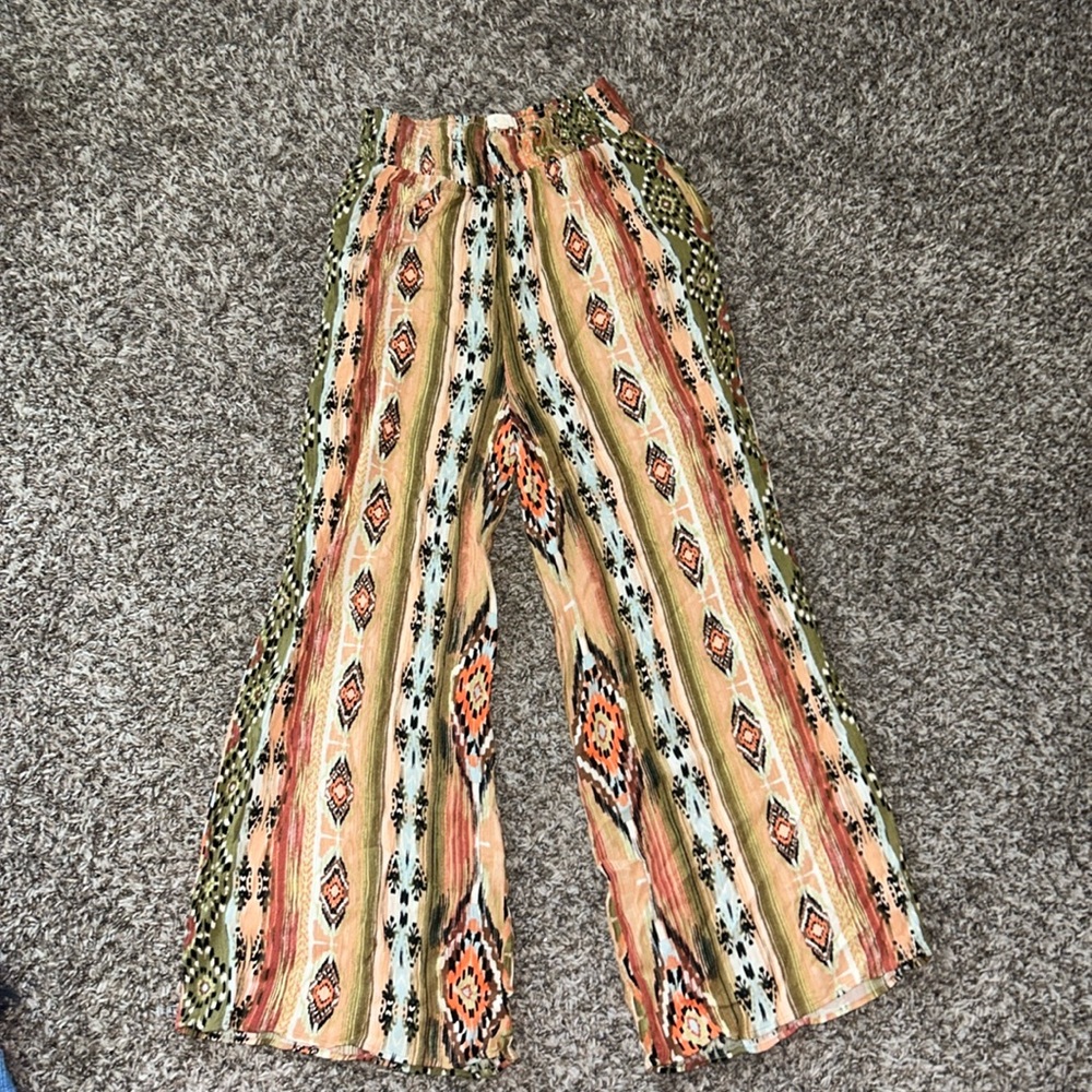 Multi colered, flowy pants. Size is small and brand is Easel